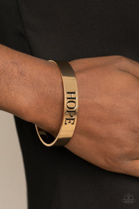 Paparazzi Hope Makes The World Go Round - Gold Cuff Bracelet